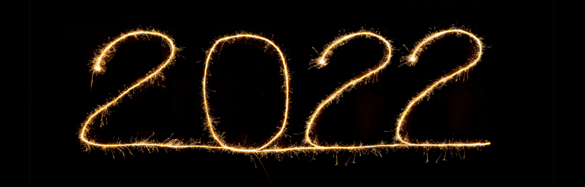 The numbers 2022 written in sparklers on a black background
