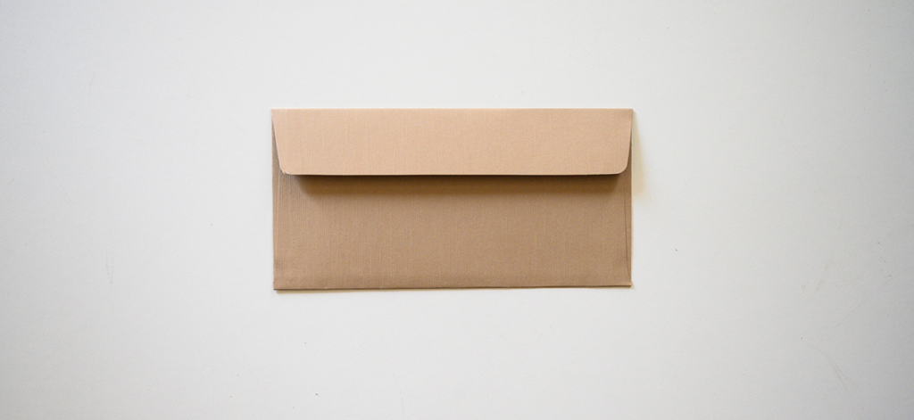 Brown envelope on gray background