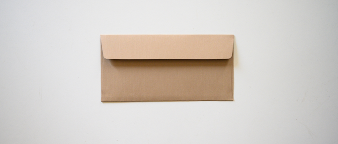 Brown envelope on gray background