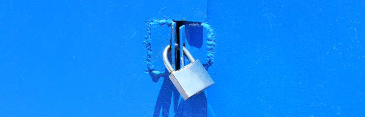 Close of up silver lock on blue door